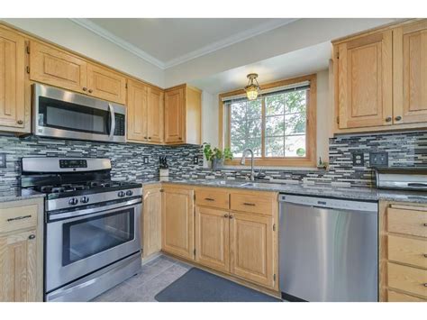 stainless steel appliances and oak cabinets|gray stainless steel cabinets.